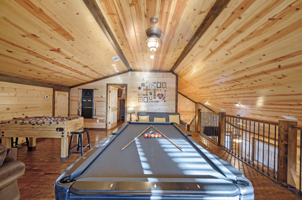 game room with billiards pool video games and movie screen